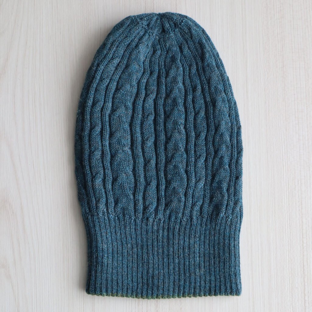 PFL Knitwear manufactor wholesaleBeanie. hat reversible baby alpaca with cable patern double knitted